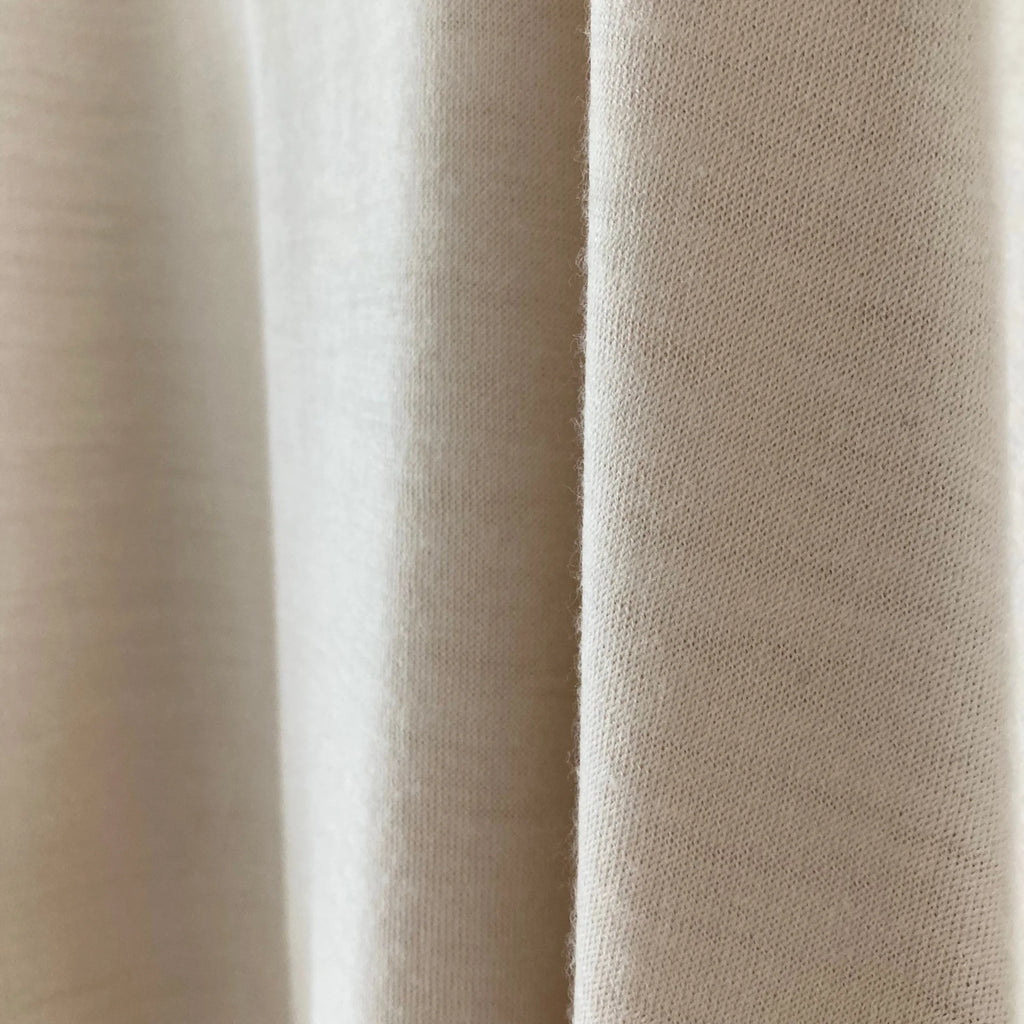 cleaveland    <br>  ”Out of everywhere”   <br> V/pullover Short sleeve  wool jersey Light beige